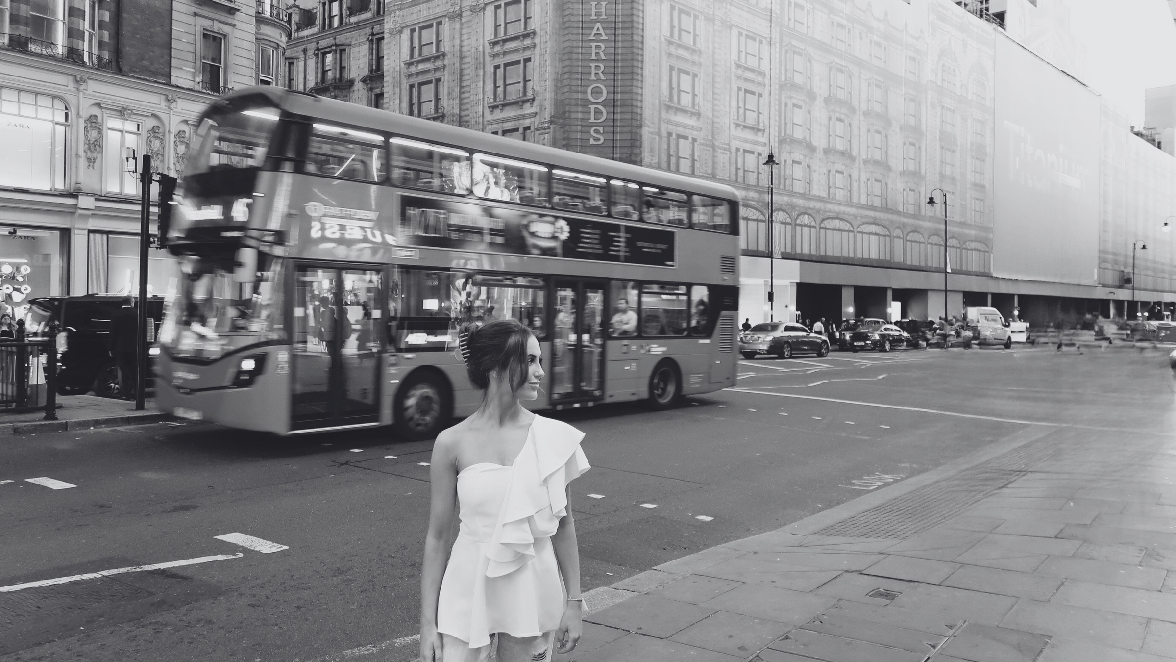 Francesca Alice London in the city of London wearing the peplum ruffle top outside harrods 